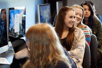 Campus group at computers in lab