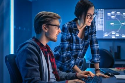 Cybersecurity students working on computer