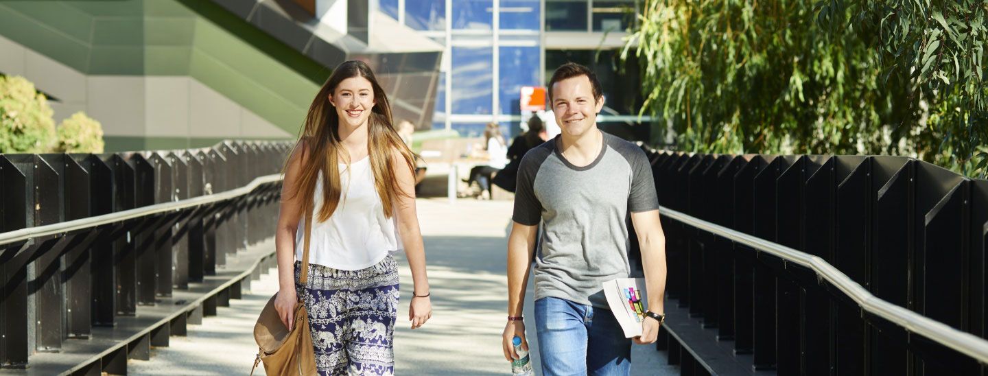 Female and male walking outdoors