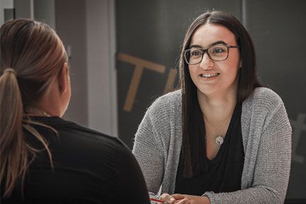 Female staff student conversation