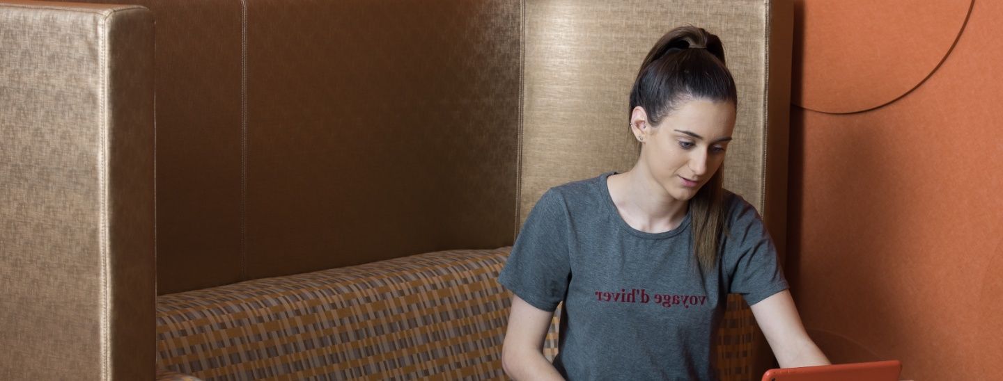 Female student looking at laptop