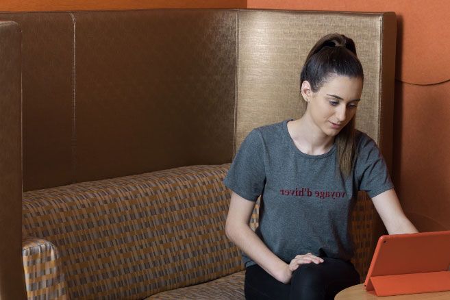 Female student looking at laptop