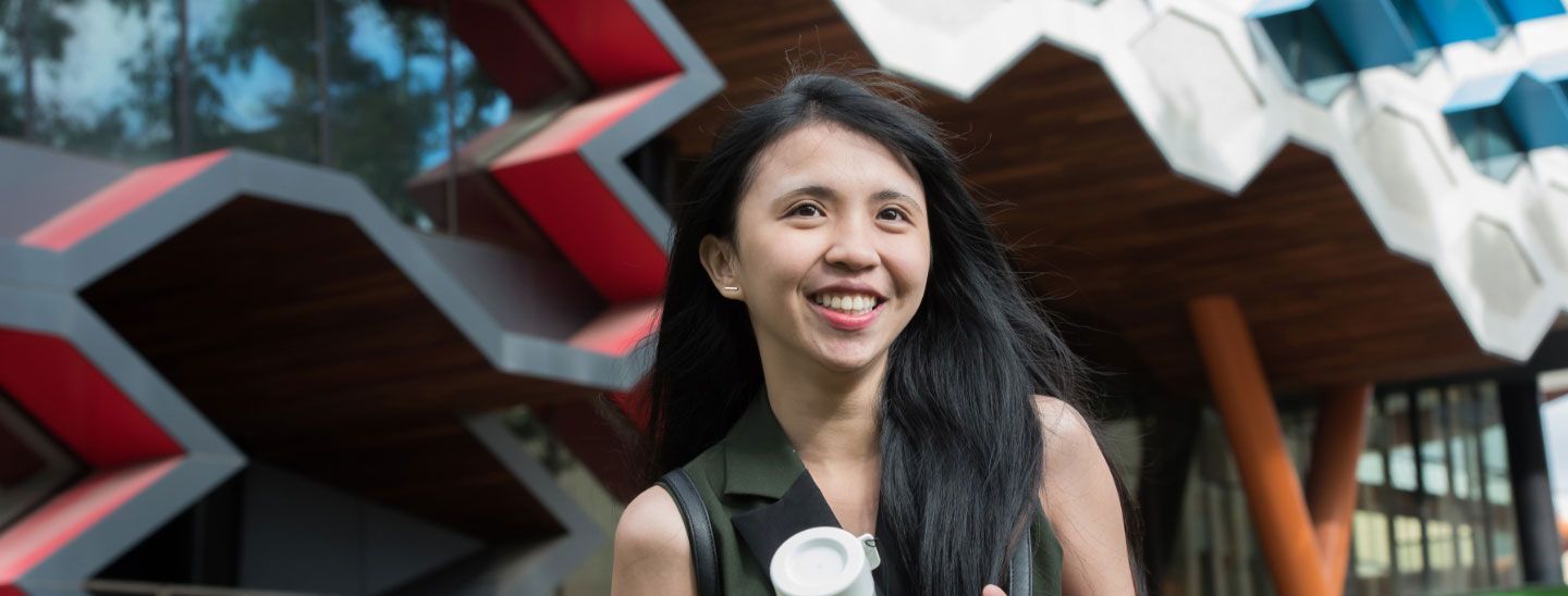 Female student outside campus building