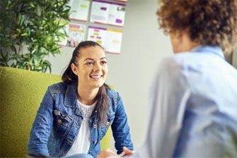 Female student talking to teacher