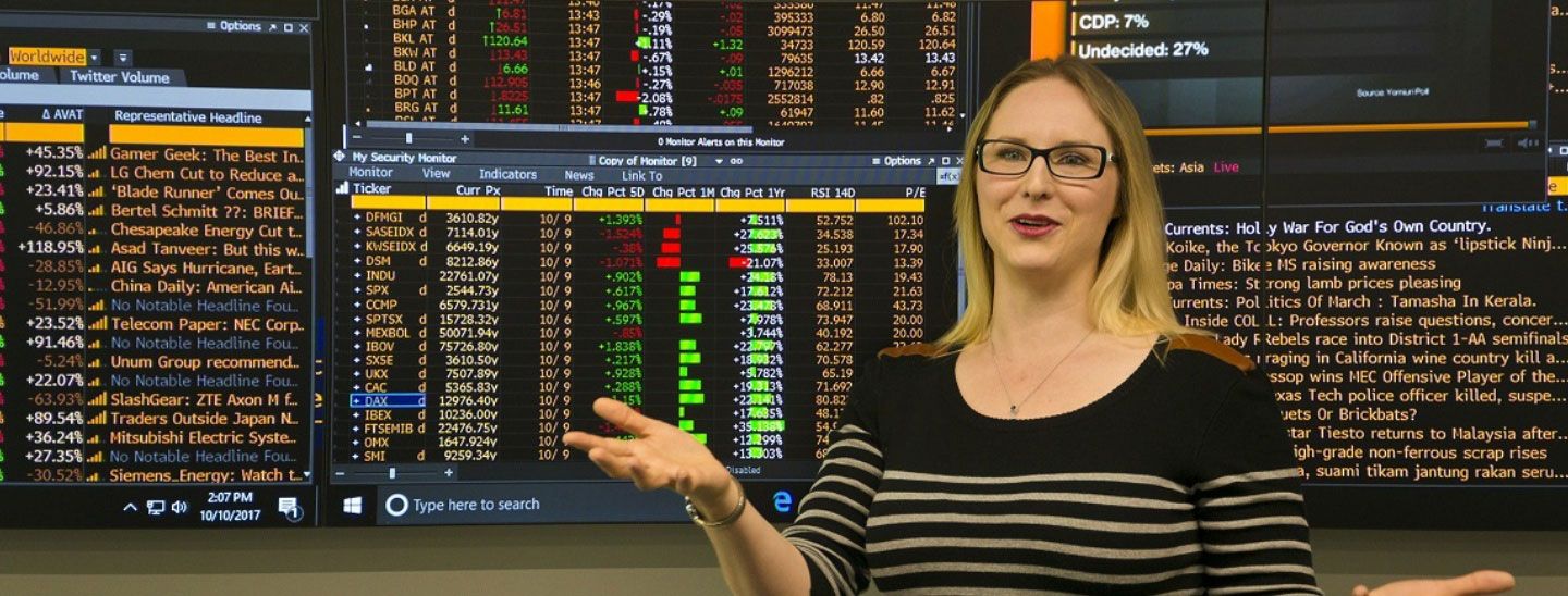 Female teacher IT marketing trading screens