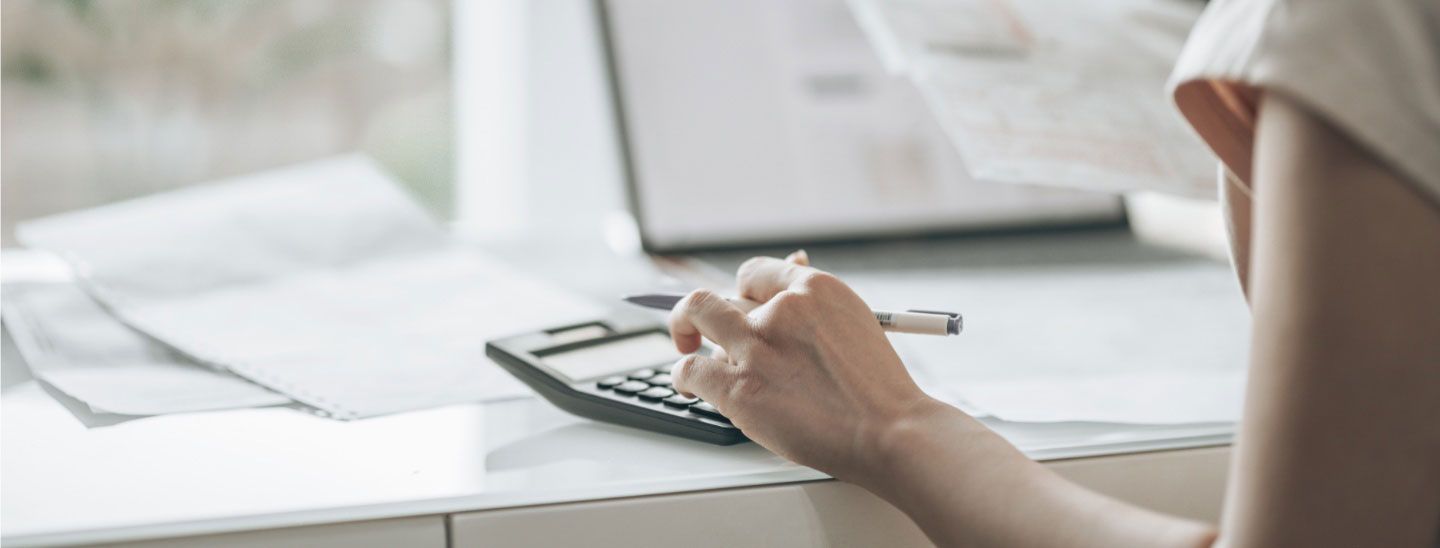 Female using calculator