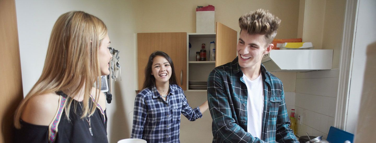 Group in kitchen talking together