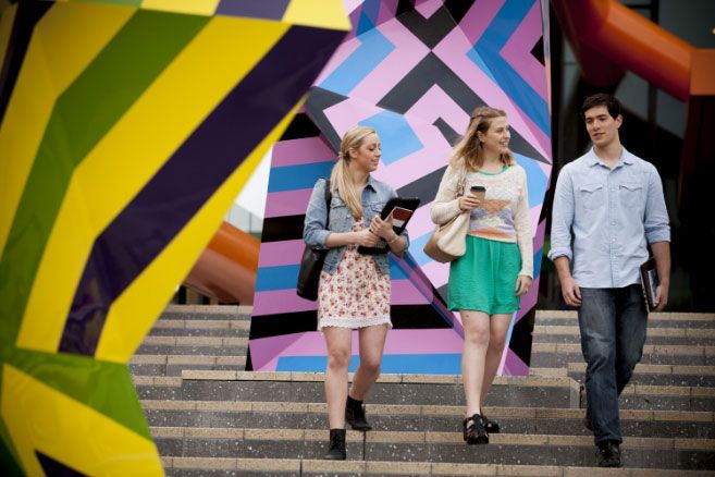 Group walking down stairs talking