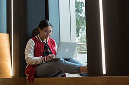 Female student sitting working