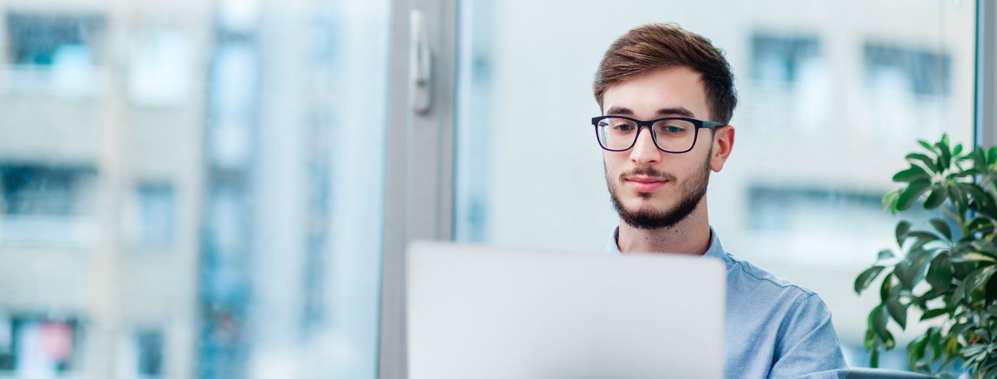 Male student on laptop