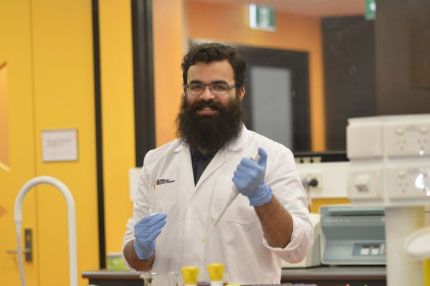 Mature male science student campus lab