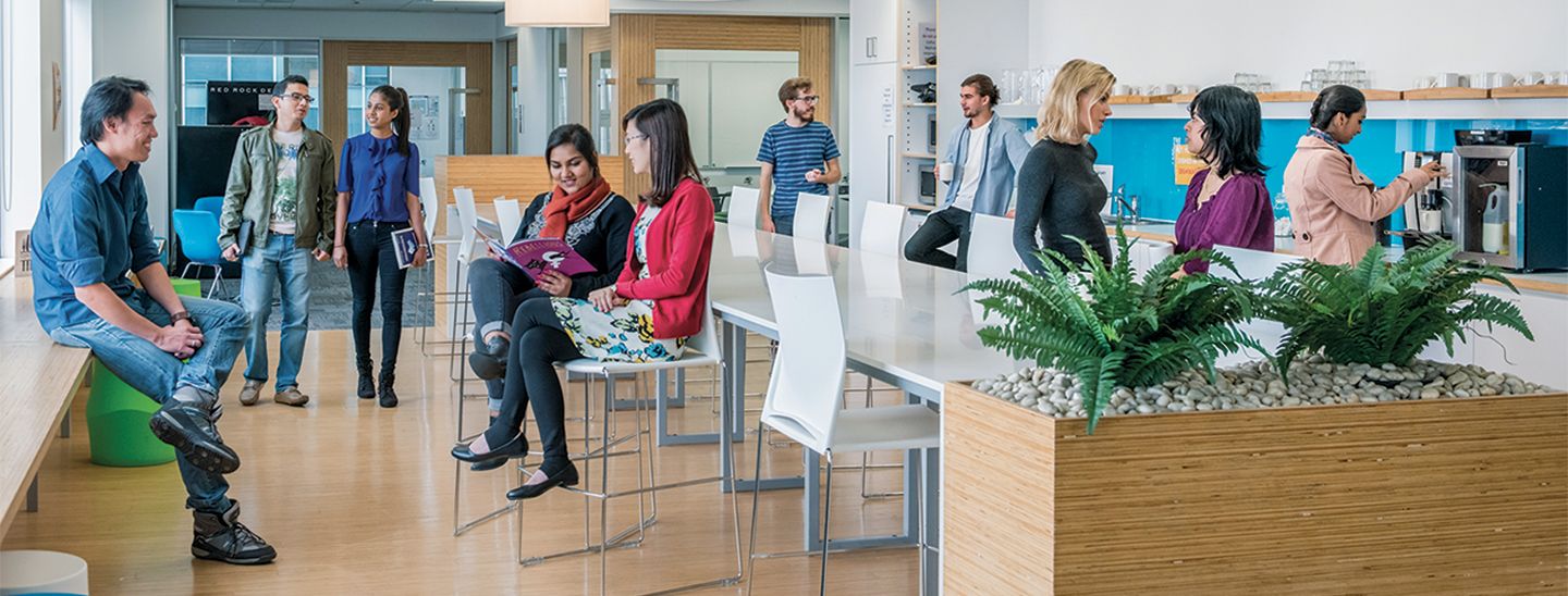 Students sitting in the cafeteria area in college