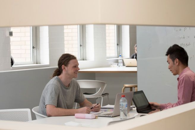 Teacher discussing with student