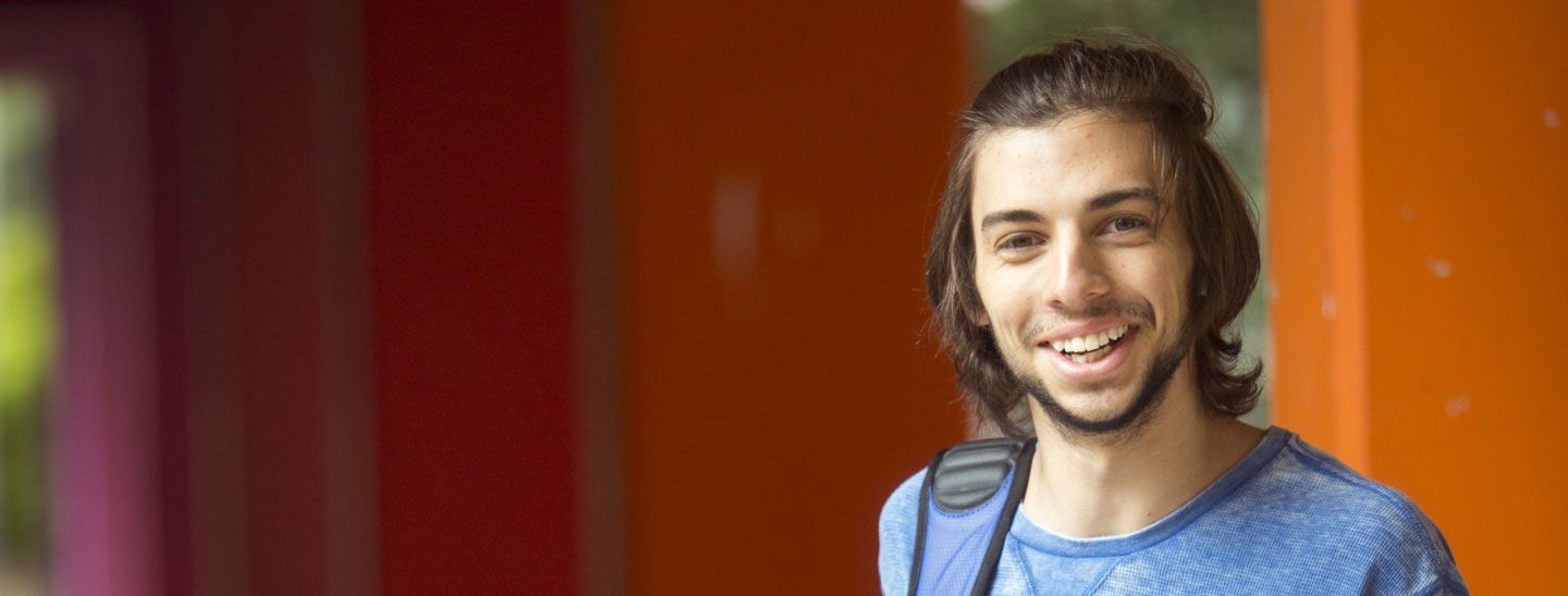 Young male student smiling